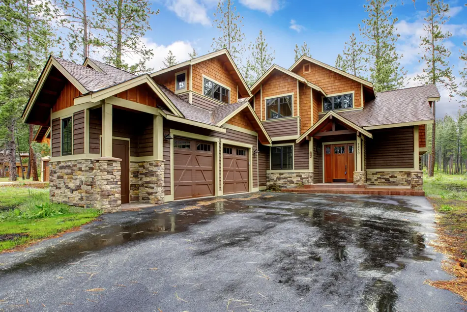 mountain home with wood siding and stone accents